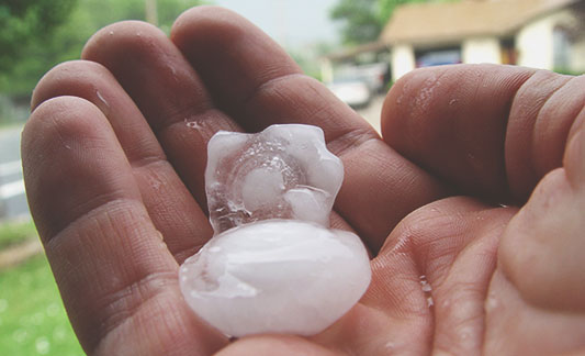 Read more about the article How Hail & Wind Damage Affects Your Roofing Shingles